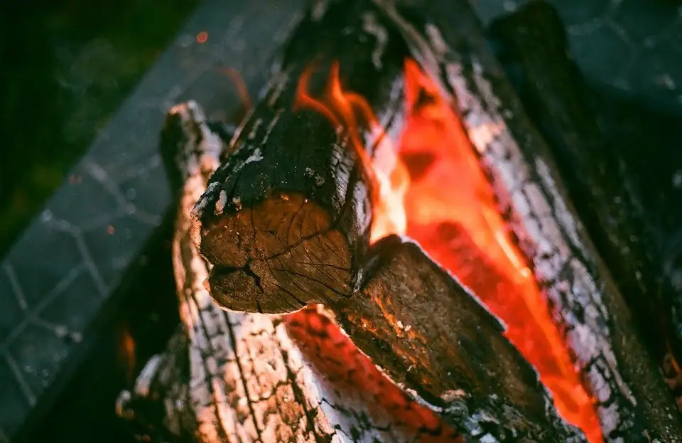 Glowing logs in a fire.