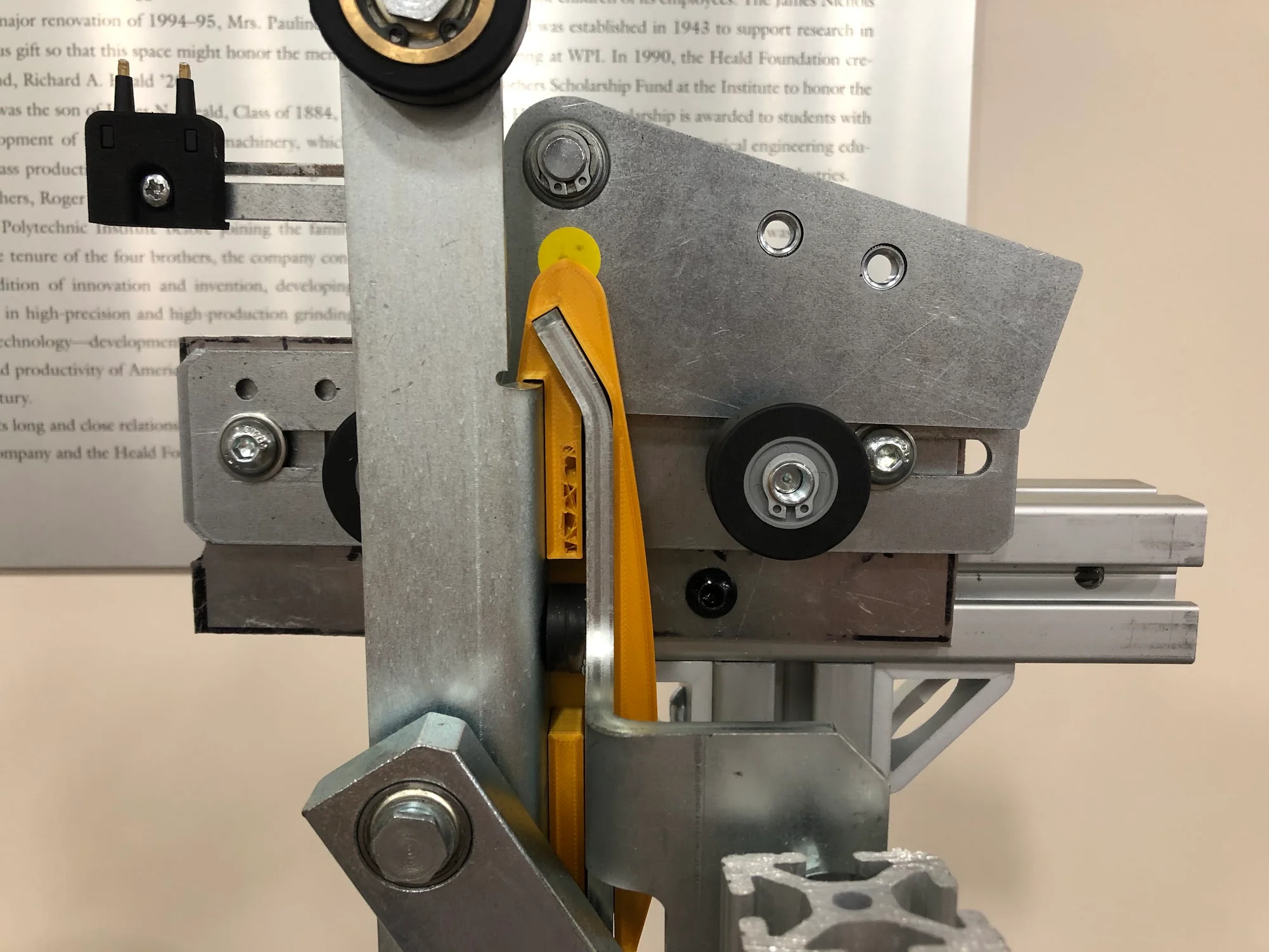 Yellow alignment guide fitted between the vane and interlock hardware on the demonstration fixture.