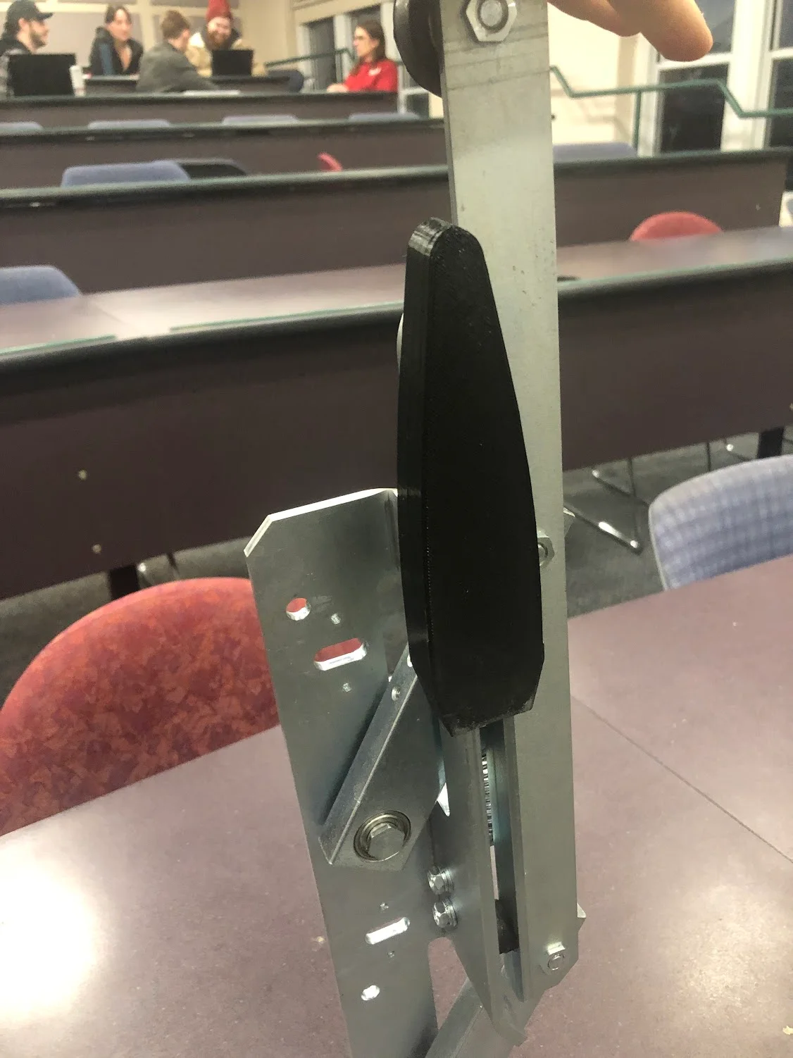 Black alignment guide fitted alongside the elevator door hardware.